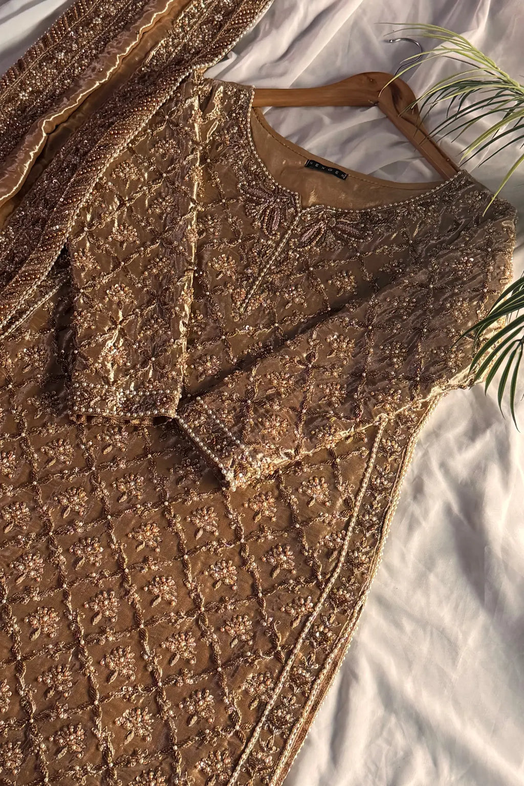 Brown textured fabric with a pattern on a white background