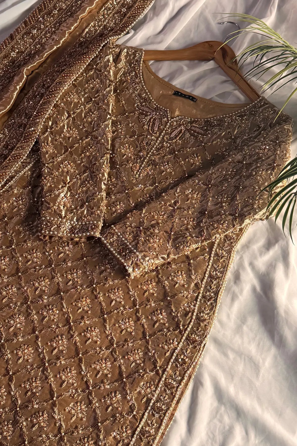 Brown textured fabric with a pattern on a white background